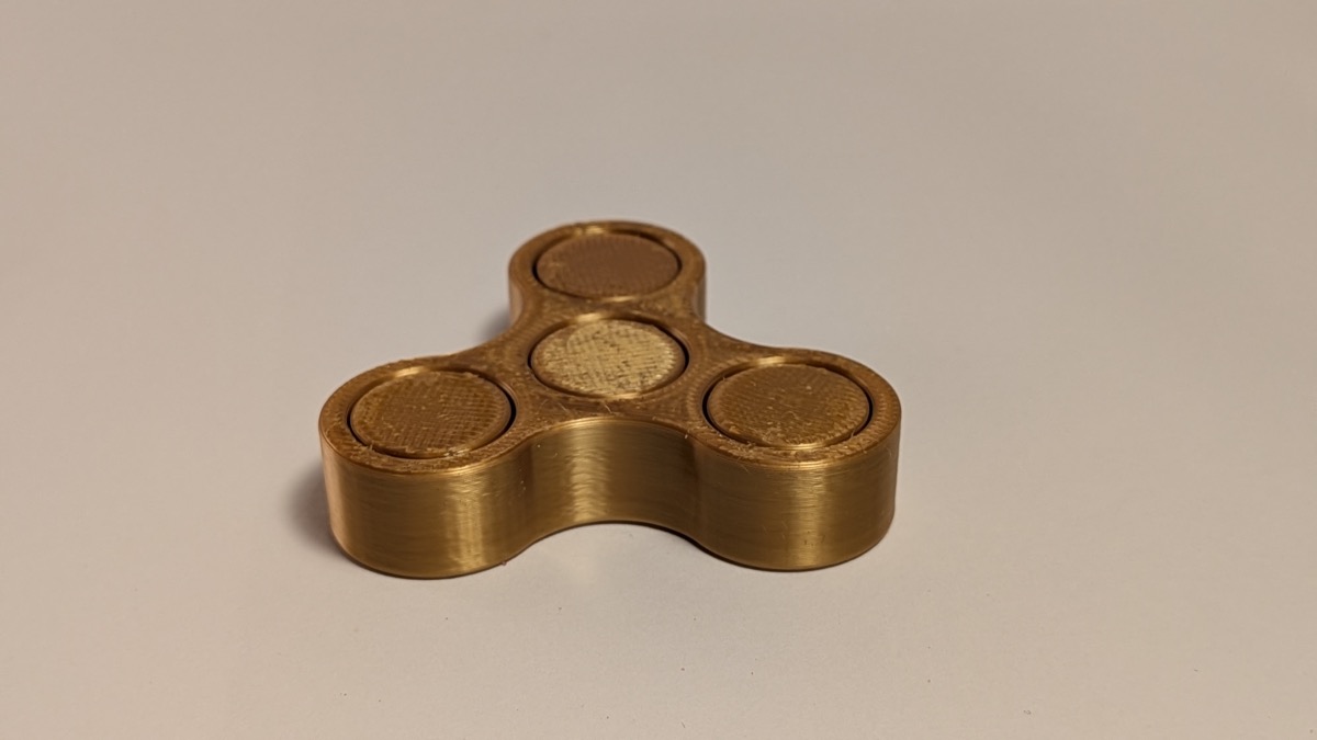 Gold 3D printed tri-arm fidget spinner