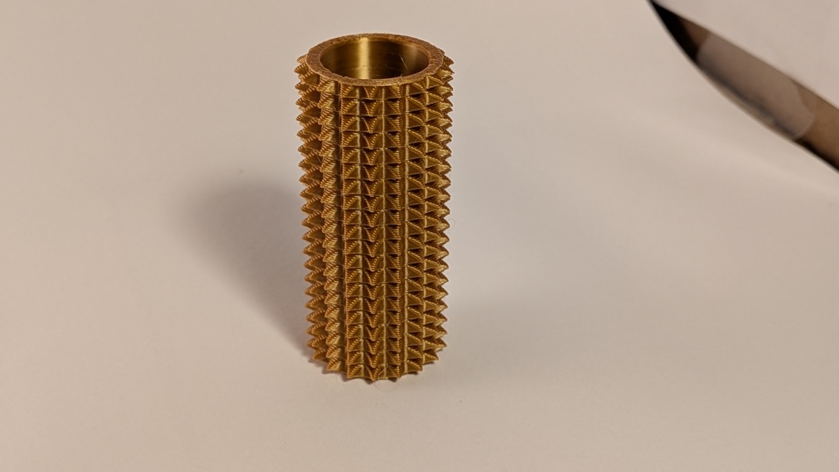 Gold 3D printed spikey fidget roller